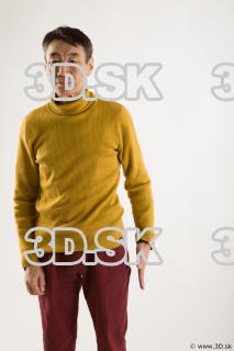 Arm flexing reference of yellow sweater red trousers Sidney 0001